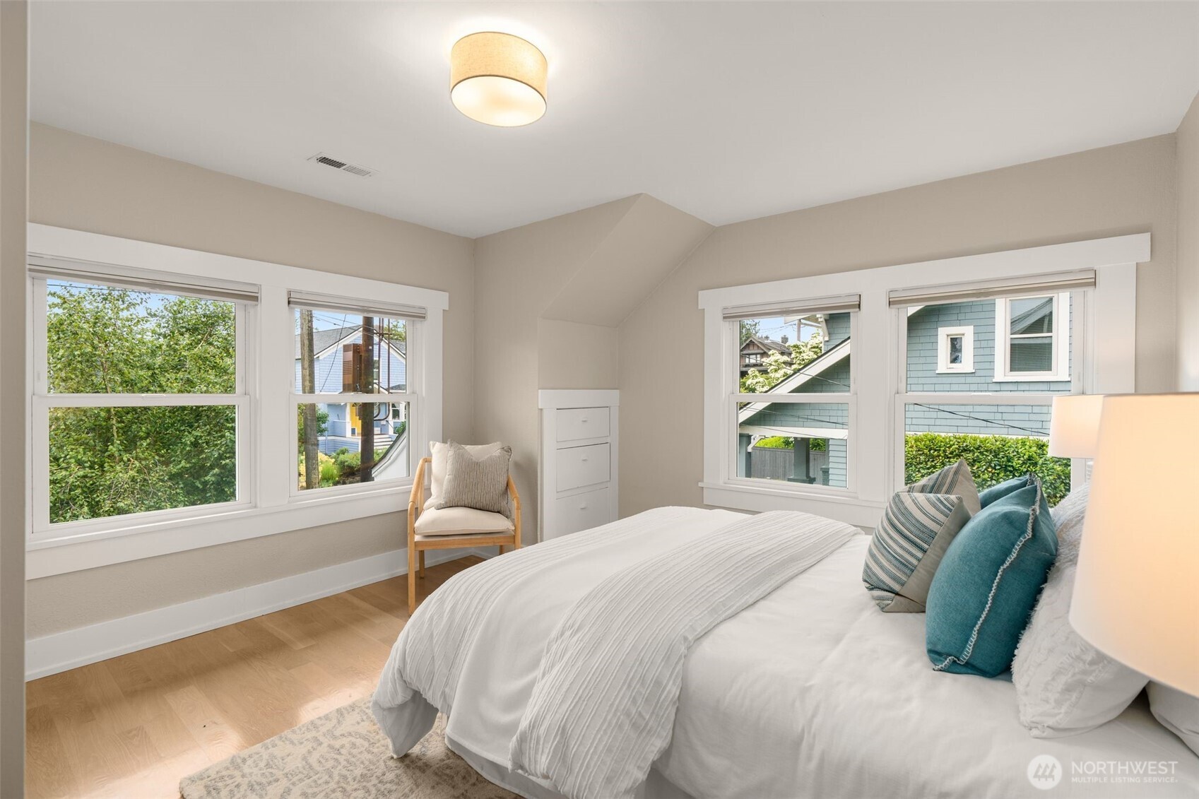 170 Lynn Street Seattle, WA 98109 - Photo 22 of 40 a bedroom with a bed and a large window