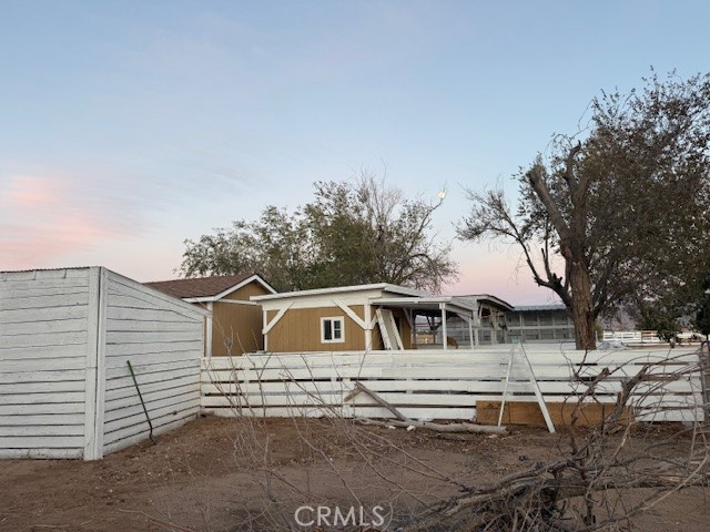 16100 Navajo Road Apple Valley, CA 92307 - Photo 25 of 55 a front view of a house with a yard