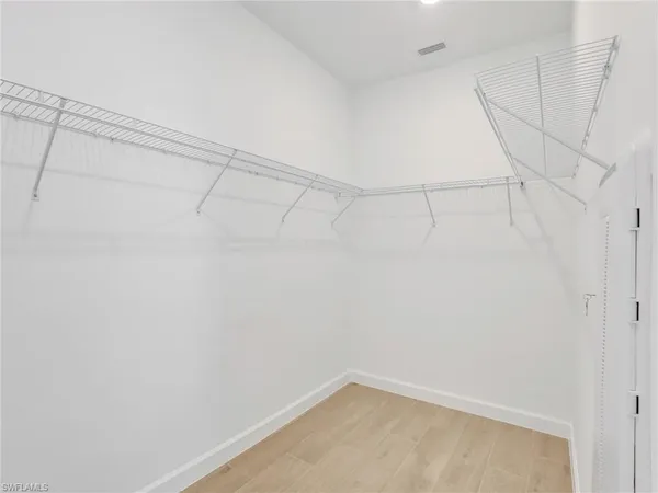 a view of a room with racks on the wall