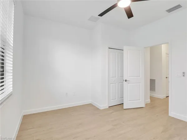 a bathroom with a sink toilet vanity tub and shower
