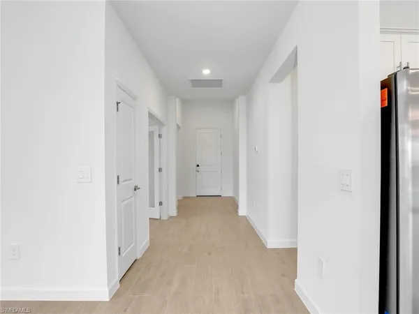 a view of a hallway with closet