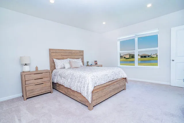 a view of walk in closet with clothes