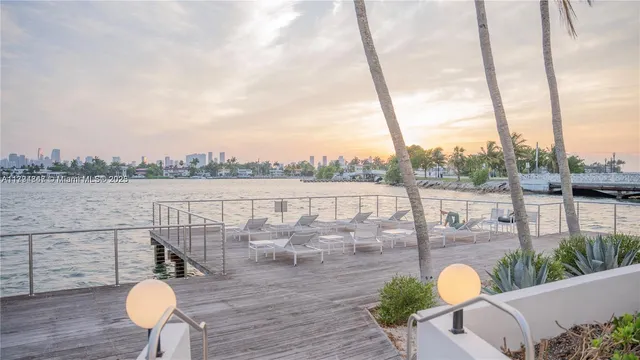 a view of a swimming pool and an outdoor space