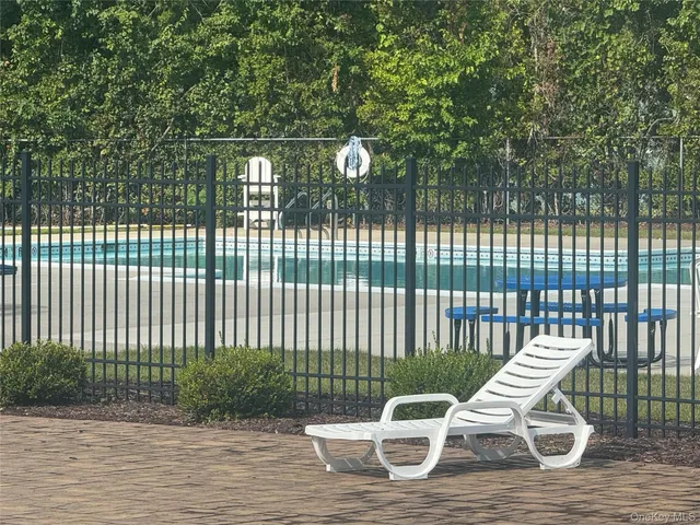 a view of a porch with furniture and a yard
