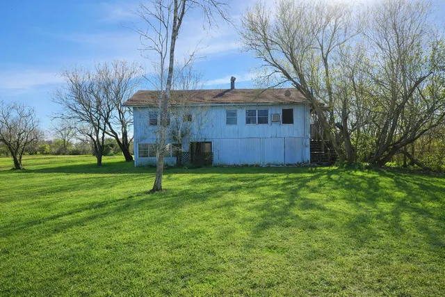 a house view with a garden space