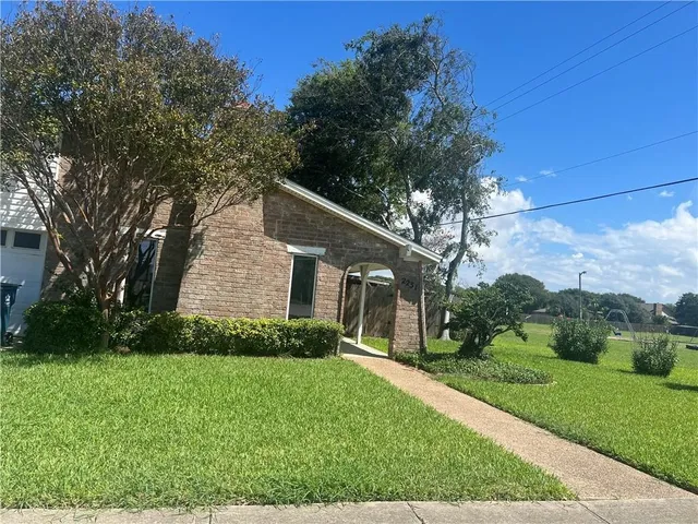 a backyard of a house with lots of green space