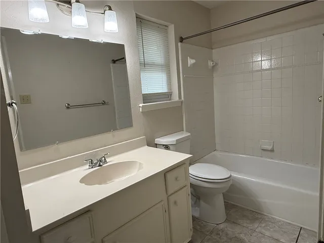 a bathroom with a sink toilet tub and shower