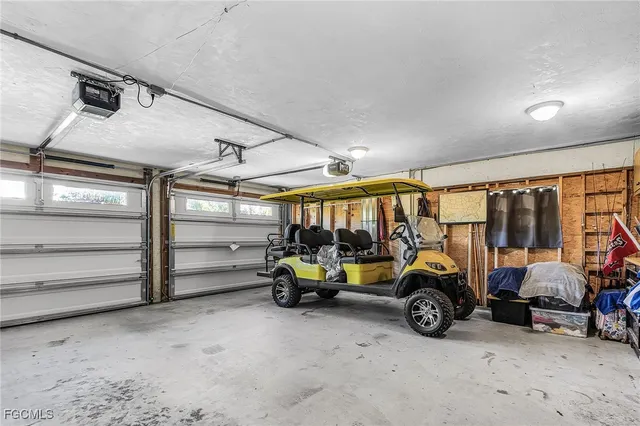 an aerial view of residential building and lake