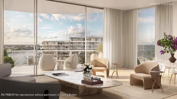 a living room with furniture and a floor to ceiling window