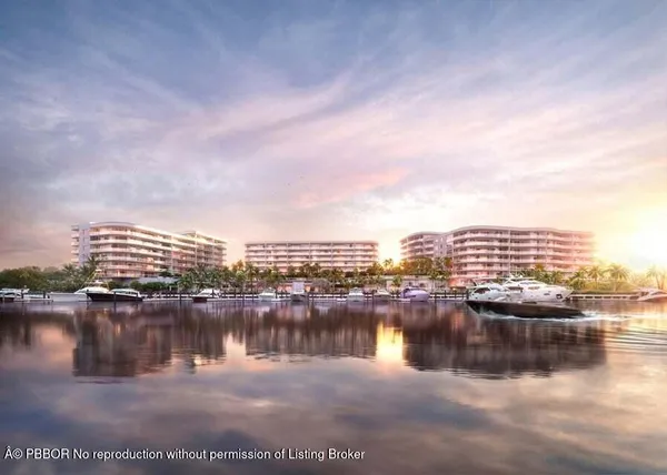 a view of water with a multi story building and lake view