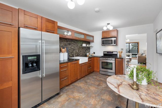 a bathroom with a sink toilet and mirror