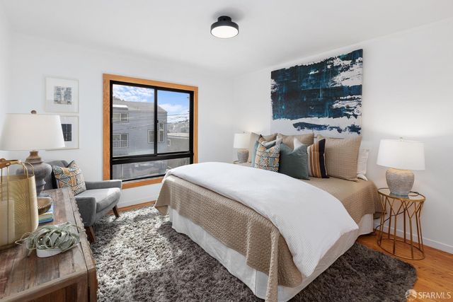 a view of backyard with a table and chairs