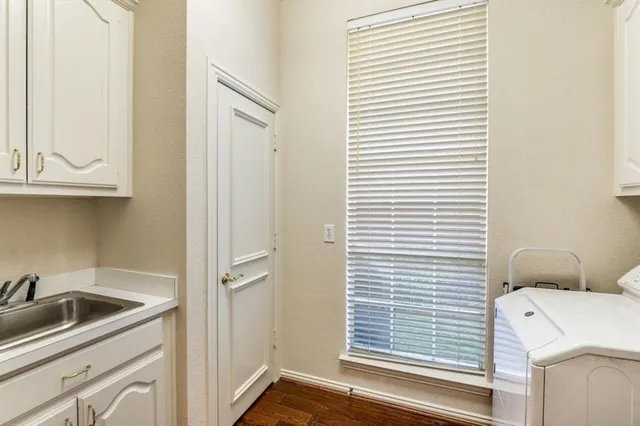 a bathroom with a sink and a window