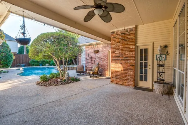 a view of a swimming pool with a patio