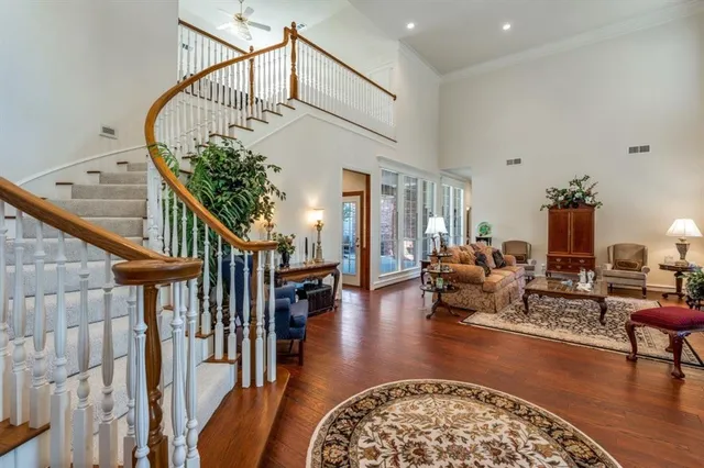 a view of entryway dining room and hall with wooden floor