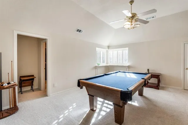 a bathroom with a sink a toilet a mirror and shower