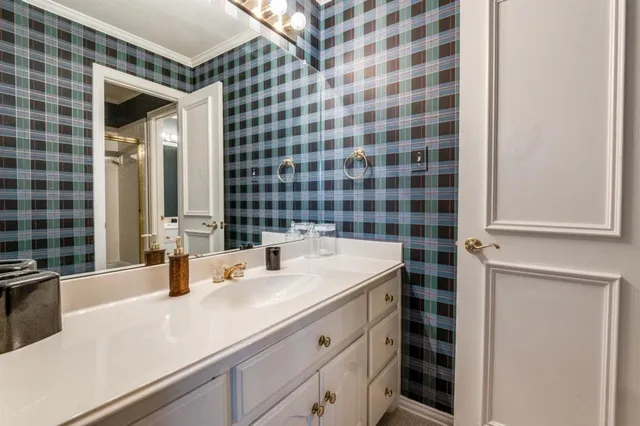 a en suite bathroom with a sink and a mirror