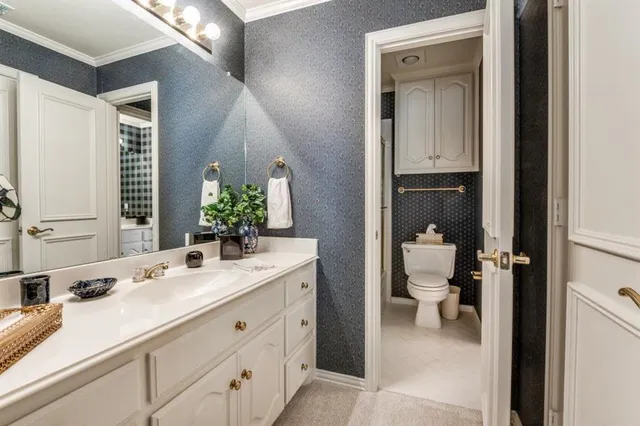 a bed room with a bed and a chandelier