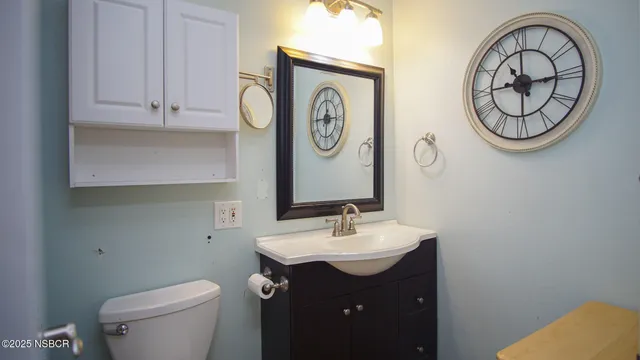 a bathroom with a toilet and a sink