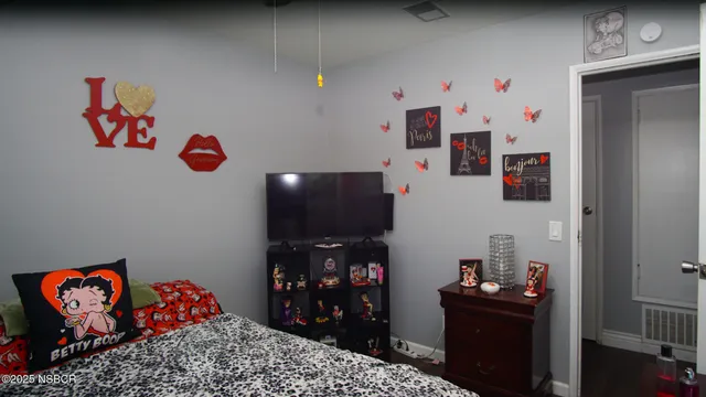 a room with toys and dresser