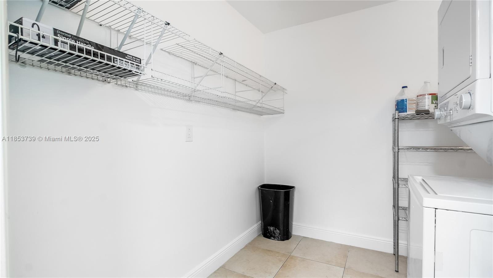 5686 Rock Island Road, Unit 106 Tamarac, FL 33319 - Photo 17 of 34 a view of storage and utility room with washer and dryer