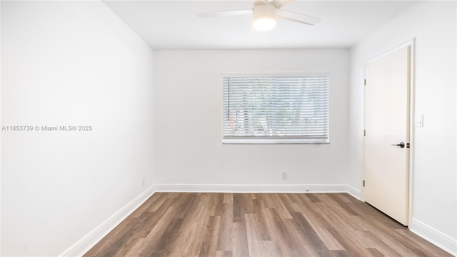 5686 Rock Island Road, Unit 106 Tamarac, FL 33319 - Photo 19 of 34 an empty room with a window