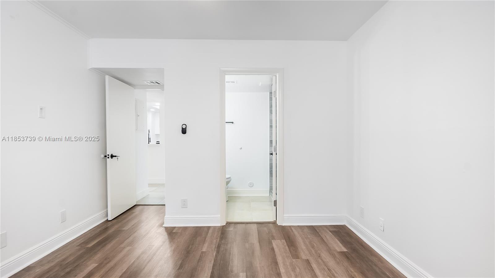 5686 Rock Island Road, Unit 106 Tamarac, FL 33319 - Photo 20 of 34 a view of a room with wooden floor
