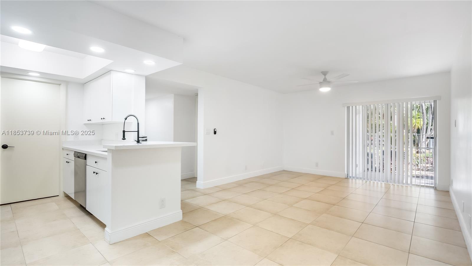 5686 Rock Island Road, Unit 106 Tamarac, FL 33319 - Photo 2 of 34 a view of a kitchen with electric appliances