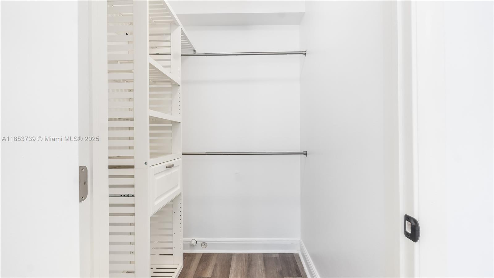 5686 Rock Island Road, Unit 106 Tamarac, FL 33319 - Photo 27 of 34 a view of walk in closet with empty racks