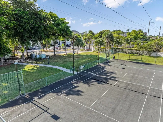 a view of a swimming pool with sitting area