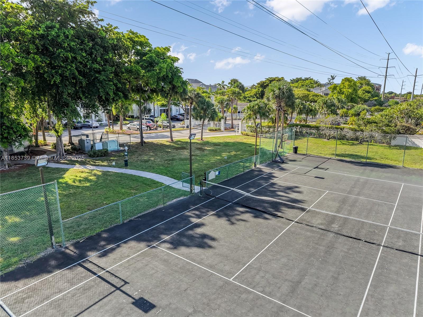 5686 Rock Island Road, Unit 106 Tamarac, FL 33319 - Photo 30 of 34 a view of a park with large trees