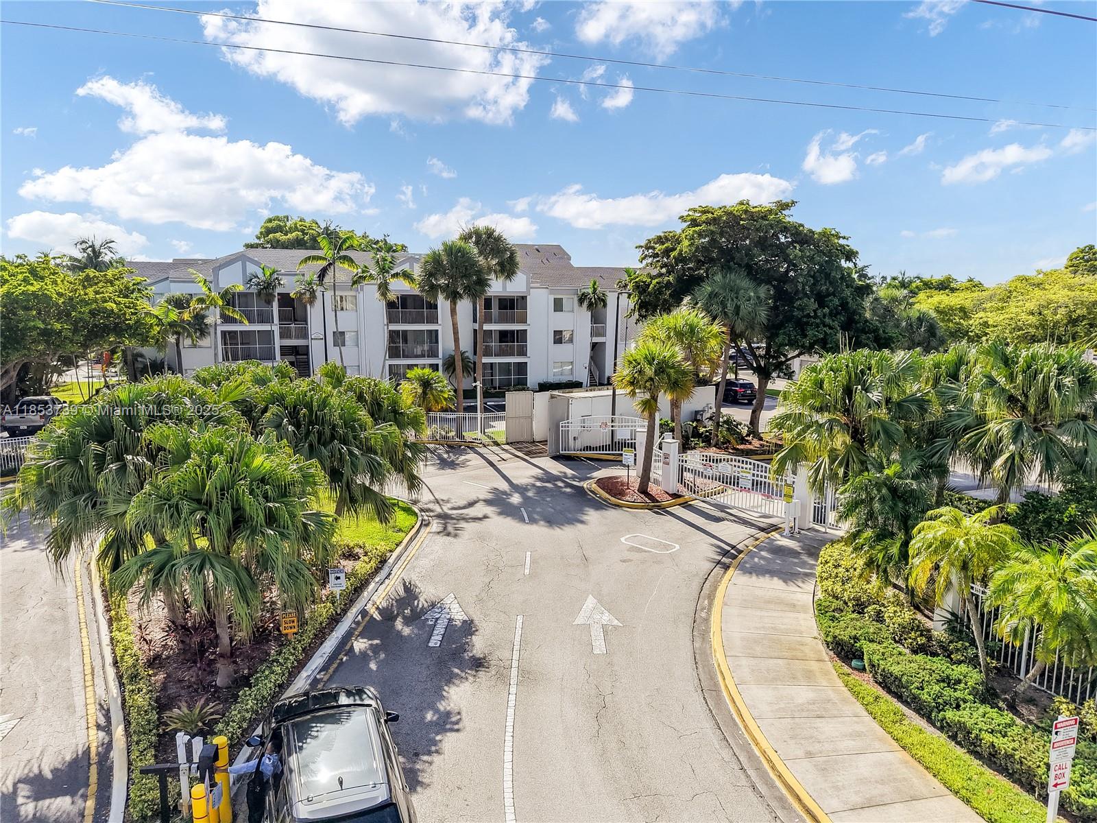 5686 Rock Island Road, Unit 106 Tamarac, FL 33319 - Photo 31 of 34 a view of a swimming pool with sitting area