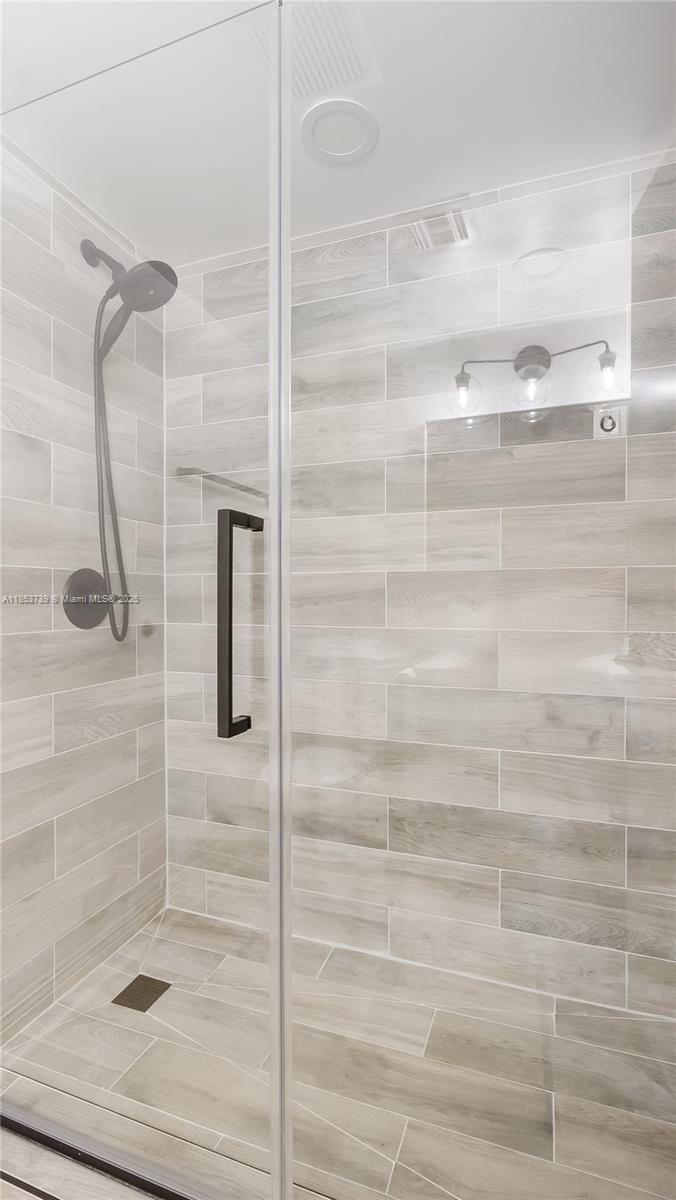 5686 Rock Island Road, Unit 106 Tamarac, FL 33319 - Photo 10 of 34 a bathroom with a shower