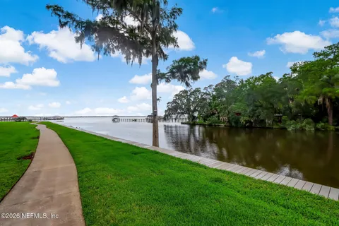 a view of a chairs and tables on the roof deck