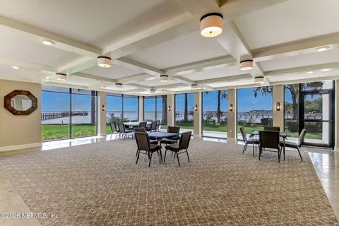a balcony with wooden floor and city view