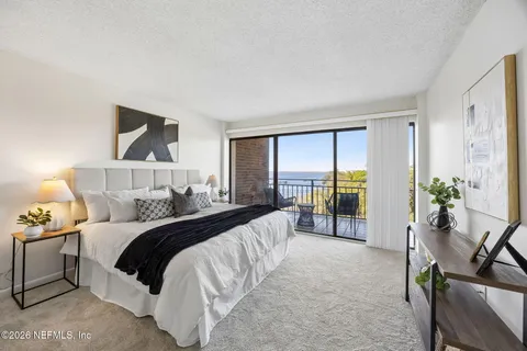 an aerial view of a residential houses with outdoor space and swimming pool
