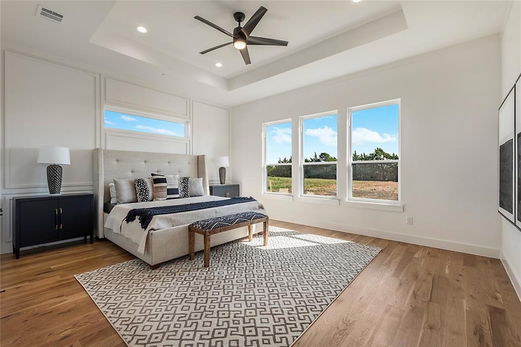 430 Whispering Way Red Oak, TX 75154 - Photo 35 of 40 Spacious room featuring wood-finish flooring, a tray ceiling with a ceiling fan, recessed lighting, and panel molding