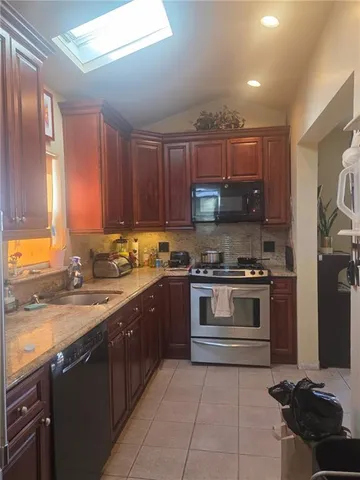 a kitchen with a stove and a sink