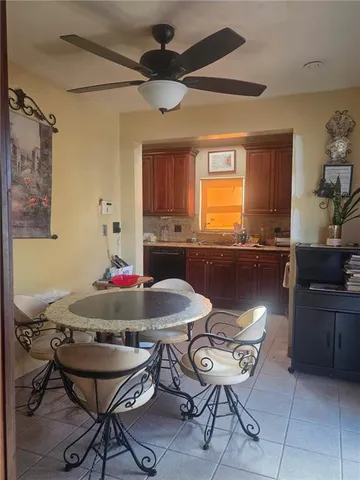 a view of a dining room with furniture and window
