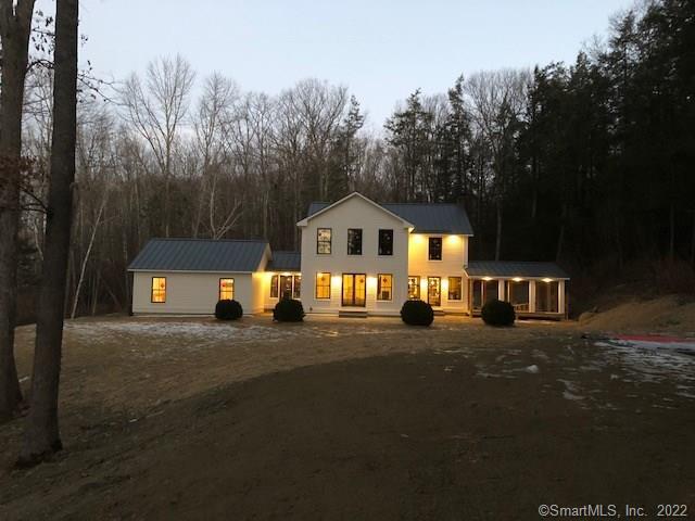 62 Burton Road Salisbury, CT 06068 - Photo 1 of 1 a front view of a house with a yard and garage