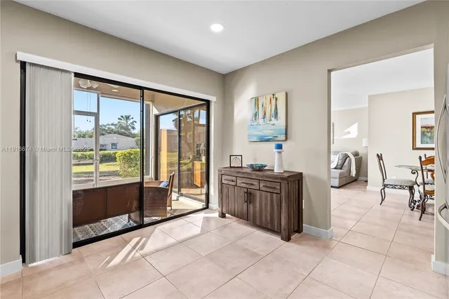 a large bedroom with a large bed and a large window