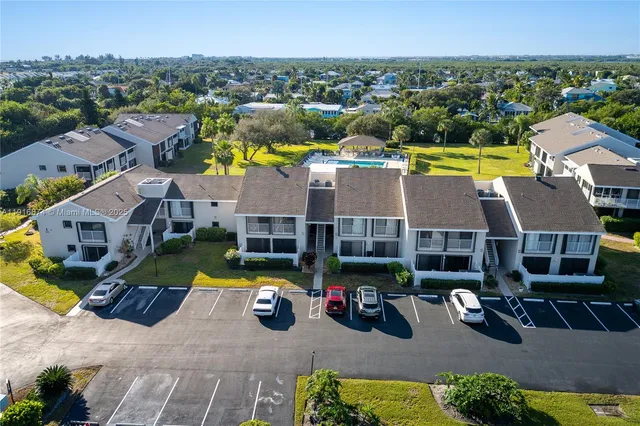 a view of multiple houses with yard