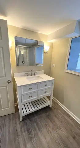 a bathroom with a sink and a mirror