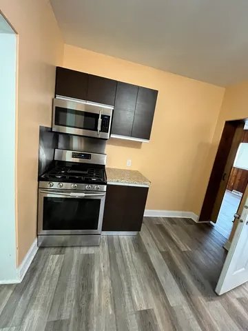 a view of kitchen with microwave and stove