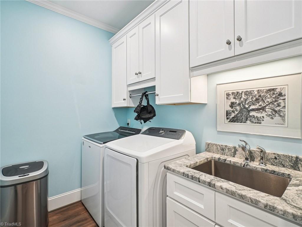 1659 Angus Ridge Drive Kernersville, NC 27284 - Photo 12 of 34 Laundry room with so much storage + Utiity Sink!