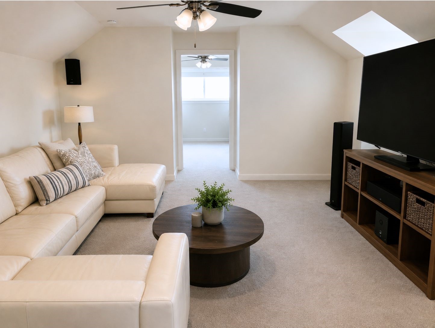 13047 Taylorcrest Road Houston, TX 77079 - Photo 14 of 23 The upstairs game room provides a spacious retreat, ideal for movie nights, a media room, playroom, or additional living space, with vaulted ceilings & natural light creating an inviting atmosphere.