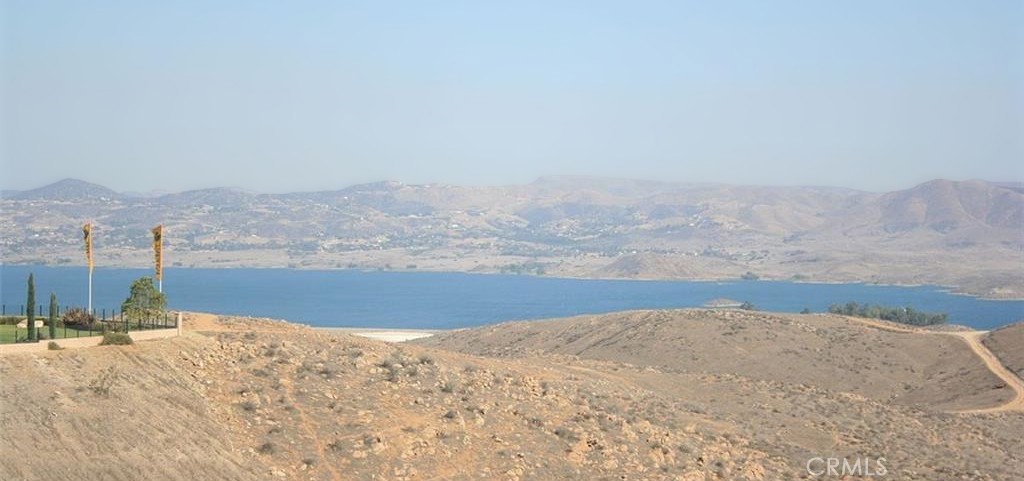 a view of ocean beach and mountain