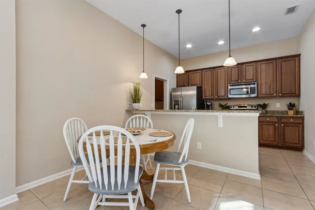 a bathroom with a sink a toilet and shower curtain
