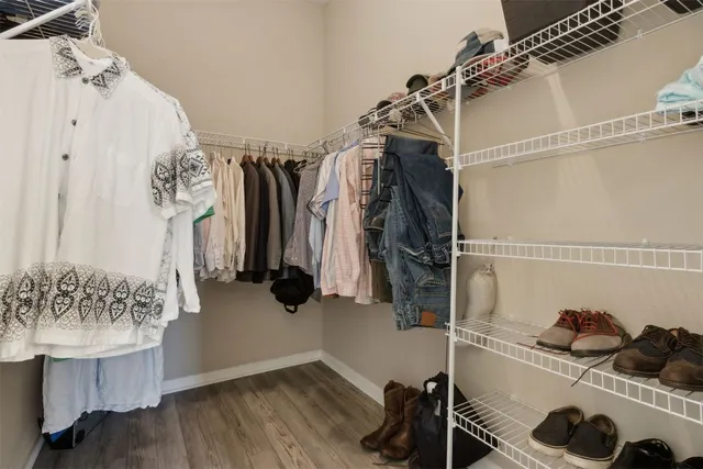 a view of street along with house and trees