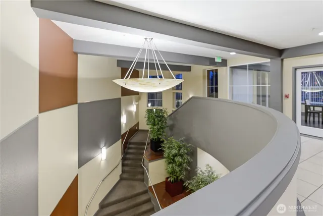 a view of a livingroom with furniture and kitchen view
